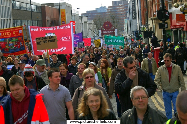 Demonstrators marching up Pinstone Street during the Liberal Democrat conference which was held at Sheffield City Hall