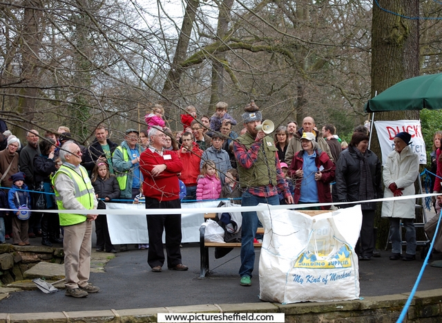 Group of people waiting for the beginning of the Charity Duck Race in Endcliffe Park on Easter Monday