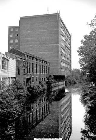 View north along the River Don from Cobweb Bridge, Five Weirs Walk, Sussex Street showing derelict property at the rear of the former Don Saw Mill and Nos. 74-90 Saville House, Savile Street