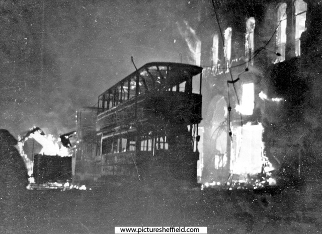 High Street, trams on fire outside the Bodega during the air raid