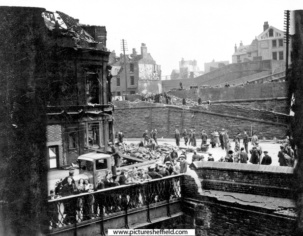 Air raid damage at Pond Hill Bridge, junction of Pond Hill and Sheaf Street. Sun Inn, junction of South Street and Gilbert Street, Park, in background