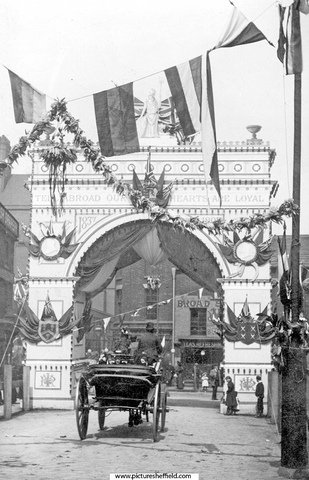 Visit of Queen Victoria, decorative arch at the junction of Broad Street and South Street, Park, photographed from South Street looking towards Broad Street, premises include Broad Street Cafe