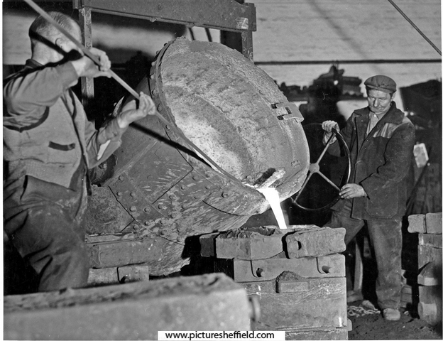 Workmen casting a mould at George Oxley's Iron Foundry.