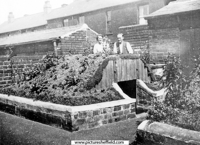 Mr. and Mrs. Grace and their Air Raid  Shelter in the garden at No. 42 Chinley Street, Bray Street behind