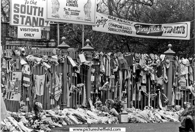 Railings outside Hillsborough Football ground with tributes to disaster victims