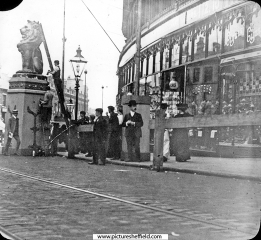 High Street (bottom of Fargate) decorated for the royal visit of King Edward VII and Queen Alexandra, No 10-16, William Foster and Son, Tailors, Foster's Buildings in background