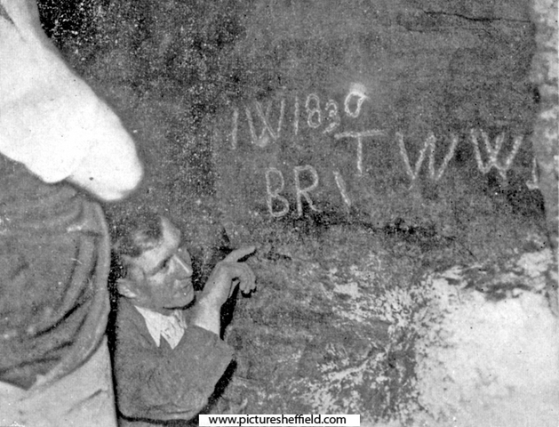 Initials and date cut deep into the rock walls of an old tunnel, discovered by workmen in 1935, below the offices of The Star newspaper at Hartshead. Explored by Frank Brindley who concluded that it was the missing tunnel to Sheffield Castle.