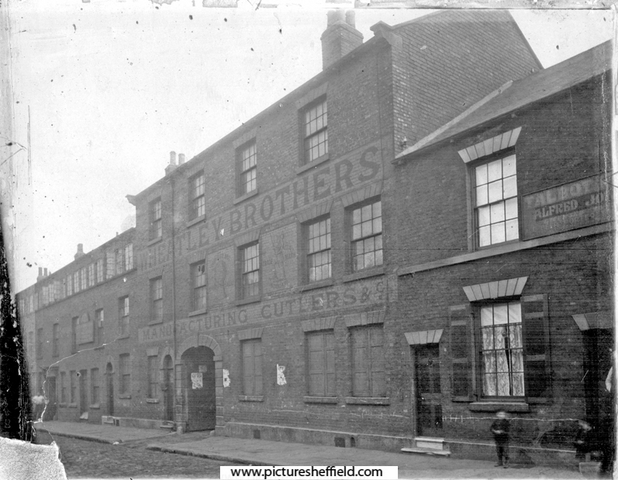Wheatley Brothers, cutlery manufacturers, Eclipse Works, Nos. 53 - 55 Boston Street (formerly New George Street). No 51, Joseph Gray and Son, surgical instrument makers, Truss Works, left. Nos. 57 - 59 Talbot Hotel, right, Court No. 11 at rear