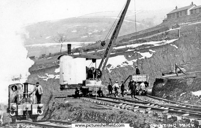 Construction of Howden Dam, shunting rubble at Birchinlee
