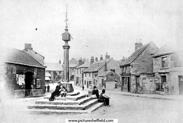 Woodhouse Market Cross, Market Square, looking towards Market Place. Cross Daggers Inn, No 14, Market Square on right. The cross was erected in 1775 by Joshua Littlewood. A sun dial and weather vane were added in 1826