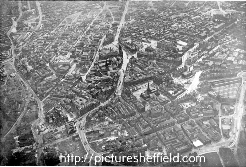 Aerial view - City Centre after the Blitz including Cathedral, Church Street, centre, Fargate, High Street, Angel Street and West Bar in foreground, Sheffield Corporation Tramway and Omnibus Depot, Tenter Street, right and Fitzalan Square and Pond St