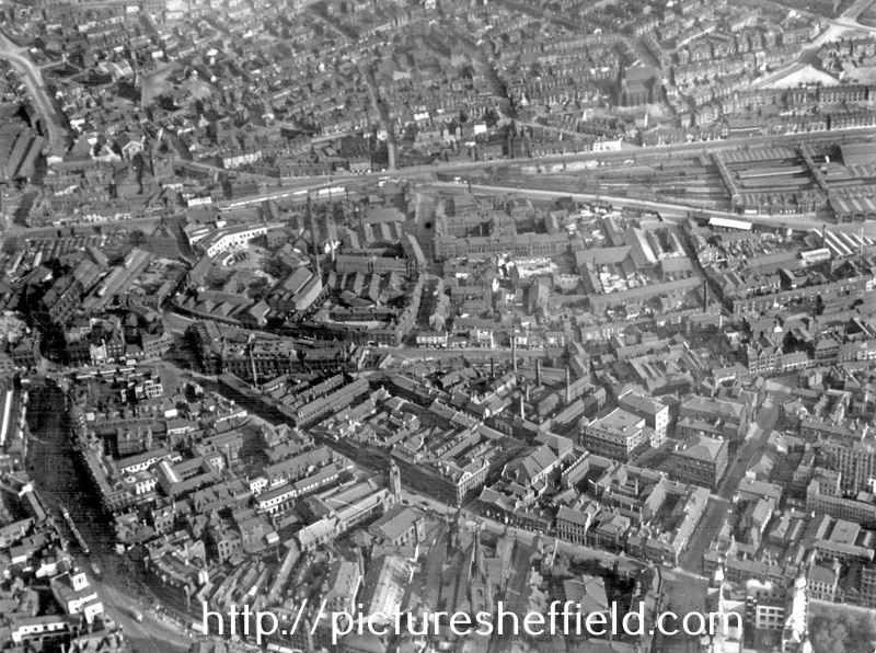 Aerial view - City Centre towards Midland Station (Sheaf Street) and Park Hill, (from left to right) High Street, Norfolk Street, Norfolk Row (note St. Marie's church) and Surrey Street in foreground, St. Luke's Church can be seen behind station