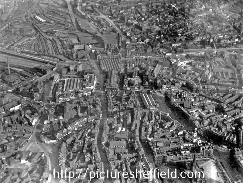 Aerial view-City Centre including (left-right) Snig Hill, Bank St to Castle St, Campo Lane and High St in foreground, River Don, Corn Exchange, Castlefolds Market, Norfolk Market Hall and Sheaf St, centre, Park Station,Canal basin and City Station, b
