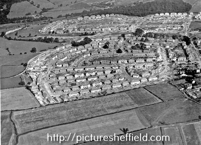 Aerial view -  Shiregreen Estate under construction showing roads including Shirehall Road, Shirehall Crescent (bottom of picture), Wood Road and Sycamore House Road (top of picture) with Woolley Wood (top of picture)