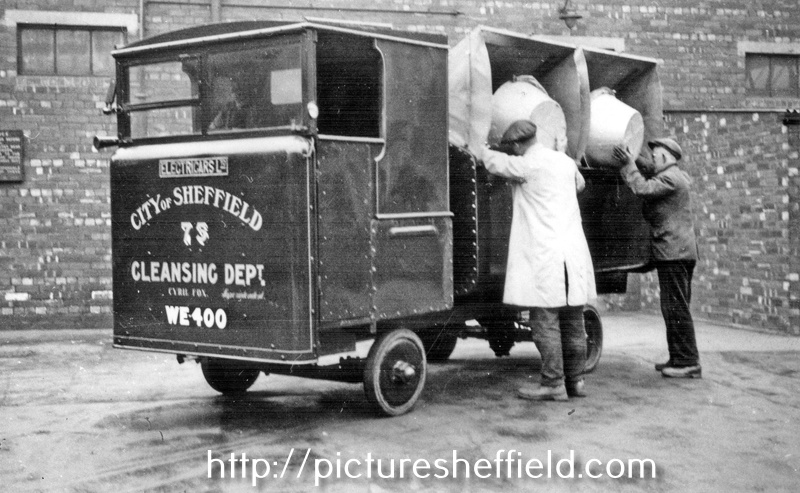 1¢ ton Electricar Refuse Collection Lorry No. 75, Registration No. WE 400, emptying the bins