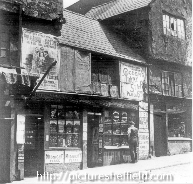 Snig Hill, left-right, No. 72 hairdressers and tobacconist belonging to Joe Turner, No. 70 oyster dealer belonging to Harry Fox