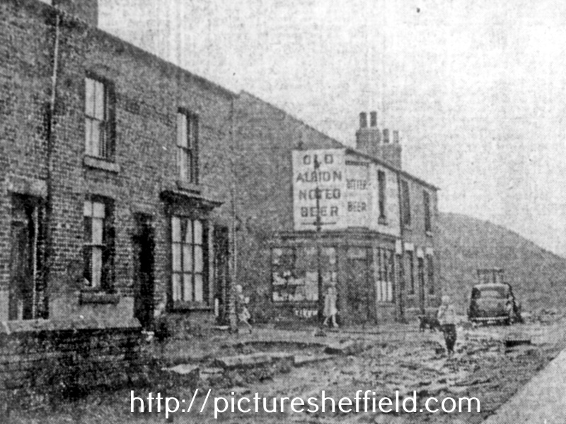 Copy of The Star's newspaper photograph of the flooding after a rainstorm on Dolphin Street, Darnall. The clouded yellow water flowed past Dolphin Street down Broad Oaks Lane to the railway line