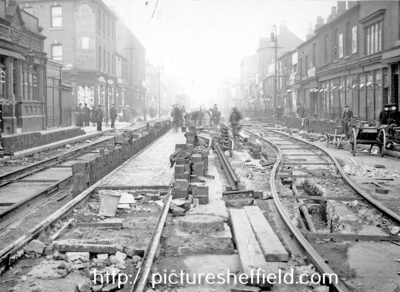 Tram-track laying on South Street, Moor, including Nos. 170 - 174 Paul Silvester Wainwright, outfitters, No. 180 Ye Woodman public house, on left