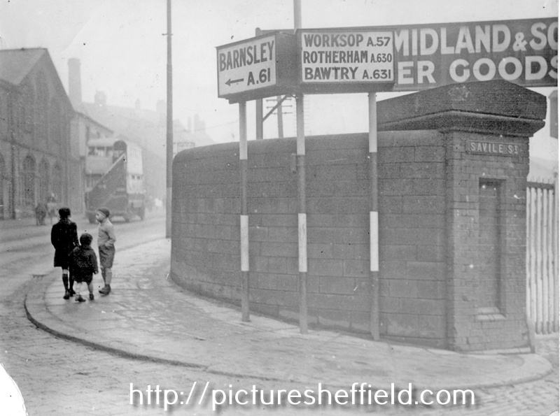 Entrance to London Midland and Scottish Railway Wicker Goods Station and electric direction sign on corner of Spital Hill and Savile Street