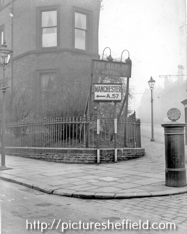 Junction of Glossop Road and Hounsfield Road, No 334, Harley Hotel, illuminated classified road sign used where the obvious route does not happen to be the main road