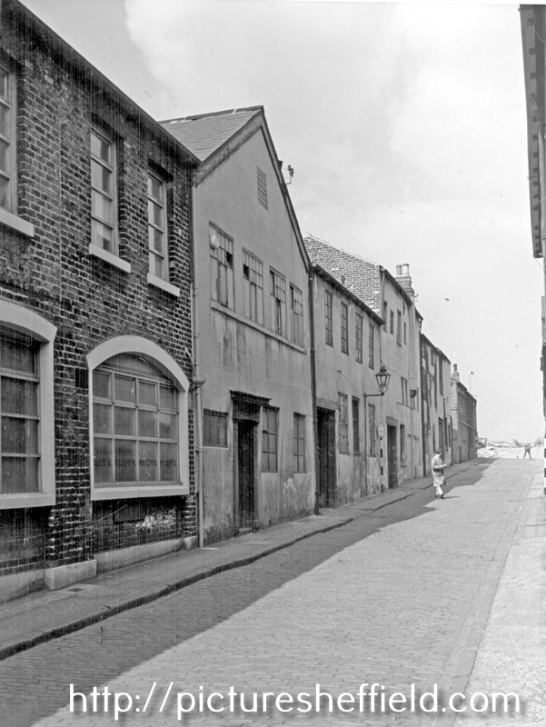 Eyre Lane from Charles Lane, premises belonging to John Paget and Son Ltd., left and premises occupied by various works including E.L. and W. Pinder, cutlery manufacturers