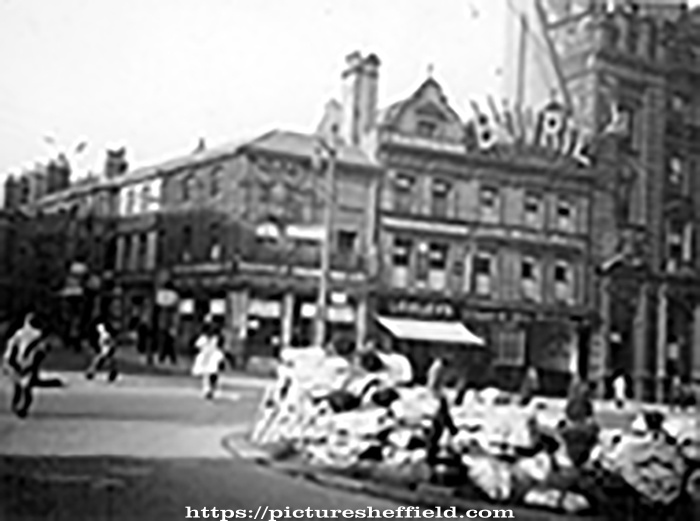 Town Hall Square and Fargate looking towards Leopold Street, including No. 70 Sheffield Creameries Ltd. (corner of Leopold Street) and No. 68 Loxley Brothers Ltd., printers, No. 66 Fleur de Lis public house, (Bovril sign)