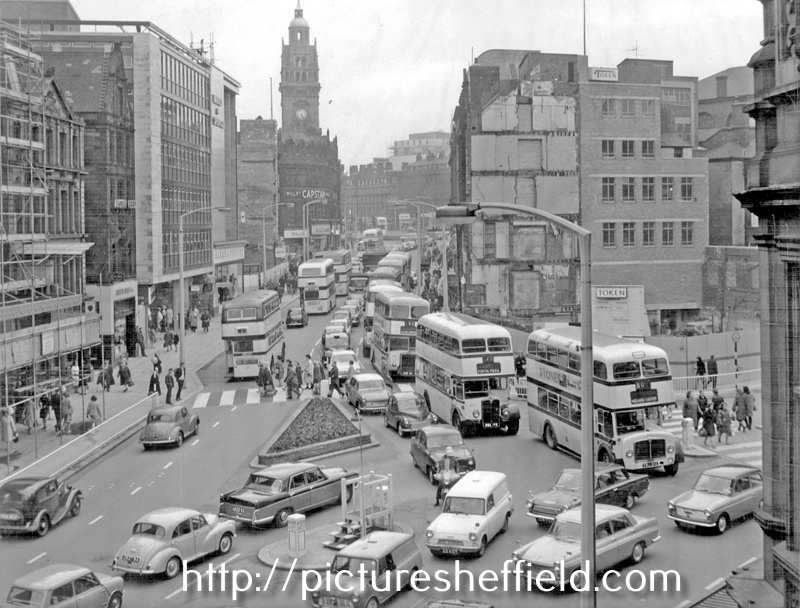 High Street looking towards Fargate, site of Cole Brothers, department store, right, No. 9 Austin Reed Ltd., mens outfitters, Fargate Court and Marks and Spencer, left