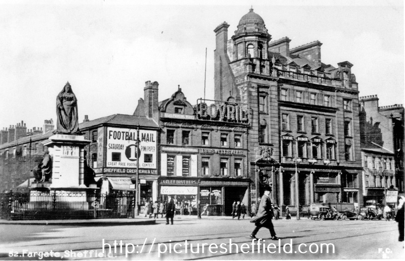 Town Hall Square/Fargate, looking towards Leopold Street, including No. 70 Sheffield Creameries Ltd. (corner of Leopold Street), No 68 Loxley Brothers Ltd., printers, No. 66 Fleur de Lys public house and Bank Chambers, (left) Queen Victoria Statue