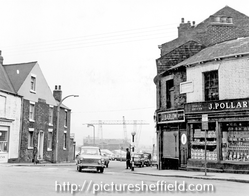 Fitzwilliam Street from Glossop Road, No 191, Glossop Road, J. Pollard, grocer, No 189, J. Barlow, butcher, Goliath Crane in background, used to construct Broomhall Flats