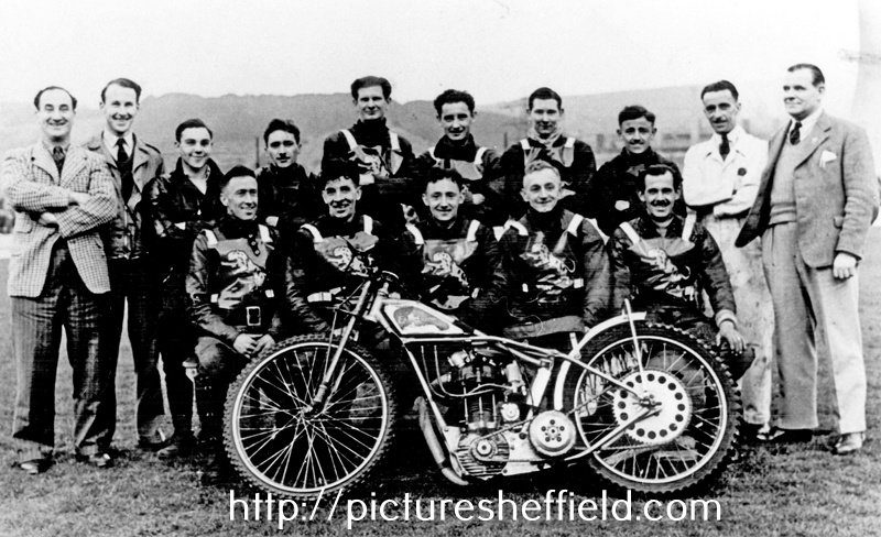 The Sheffield Tigers Speedway Team, 1940, Owlerton, captain of the team Frank Vary on extreme left wearing check jacket. Electric Power Station Cooling Tower right hand edge