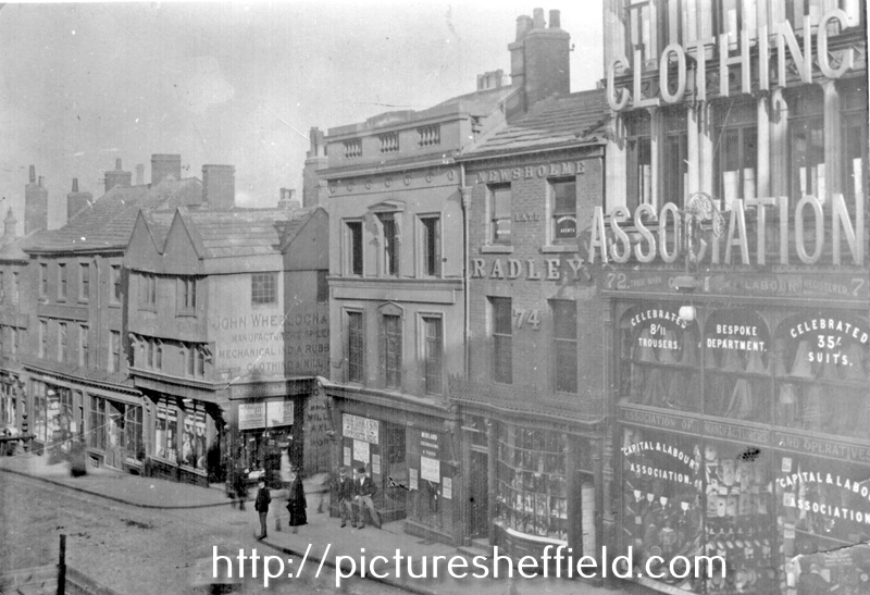 Market Place, High Street, (corner with Change Alley), No. 72 Capital and Labour Clothing Assoc., No 74, Geo. Thos. Wilkinson Newsholme, chemist, No. 76 W.F. Rodgers Ltd., printers, Nos. 78-80, John Wheeldon and Co., manufacturers of leather goods
