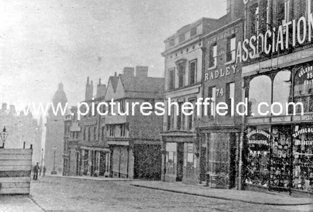 Market Place, High Street, (corner with Change Alley), No. 72 Capital and Labour Clothing Assoc., No. 74 Geo. Thos. Wilkinson Newsholme, chemist, No. 76, W.F. Rodgers Ltd., printers, Nos. 78 - 80 John Wheeldon and Co., manufacturers of leather goods