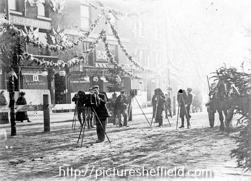 Photographers prepare for the royal visit of Queen Victoria, High Street, No 31, Old Blue Bell Hotel and No 33, London Rubber Co., in background