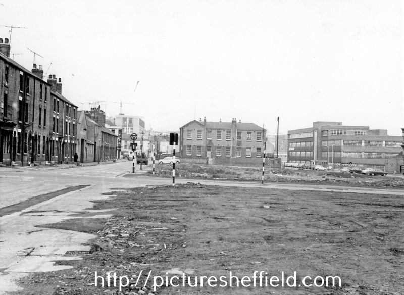 Construction of the Inner Ring Road, Hodgson Street, left (after demolition of courts and back to back housing), Clarence Street, foreground, St. Silas' School, in background