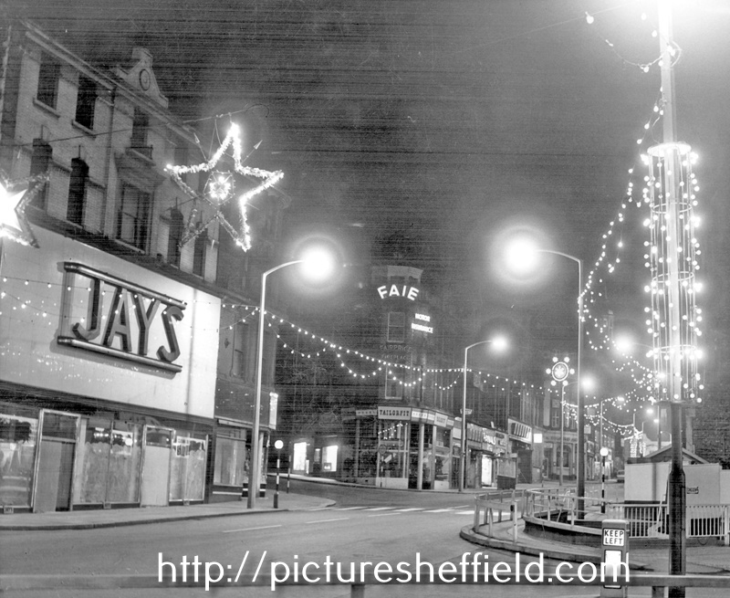 Christmas decorations on Moorhead looking towards Pinstone Street, No. 2 Moorhead, James Coombes and Co. Ltd., boot and shoe repairers and former premises of Jays Furnishing Stores, house furnishers