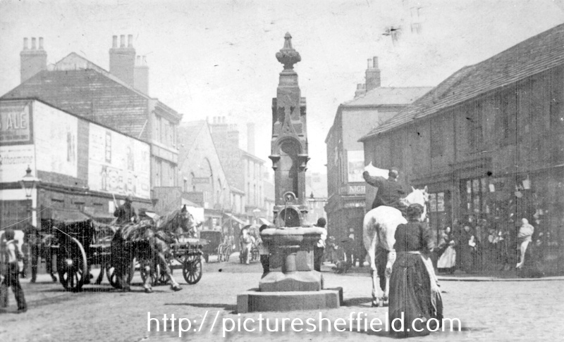 Drinking fountain at the junction of Shalesmoor/ Gibraltar Street/ Allen Street and Bowling Green Street, looking towards businesses including Thomas Nixon and son, pawnbroker, Gibraltar Street