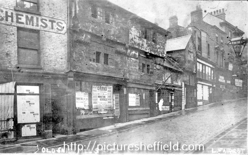 Snig Hill from West Bar, derelict timber framed shops, prior to demolition in 1900 	