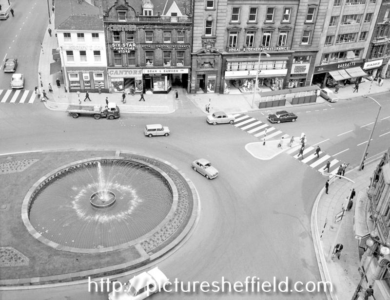 Town Hall Square and Goodwin Fountain, looking towards Fargate, premises include No. 70 Fargate, H.L. Brown and Son Ltd., jewellers, No. 68 Cantors, No. 66 Dean and Dawson Ltd., travel agents and Bank Chambers
