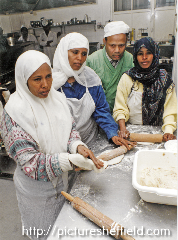 Group of women making chapattis at the Pakistan Muslim Centre, Woodbourn Road