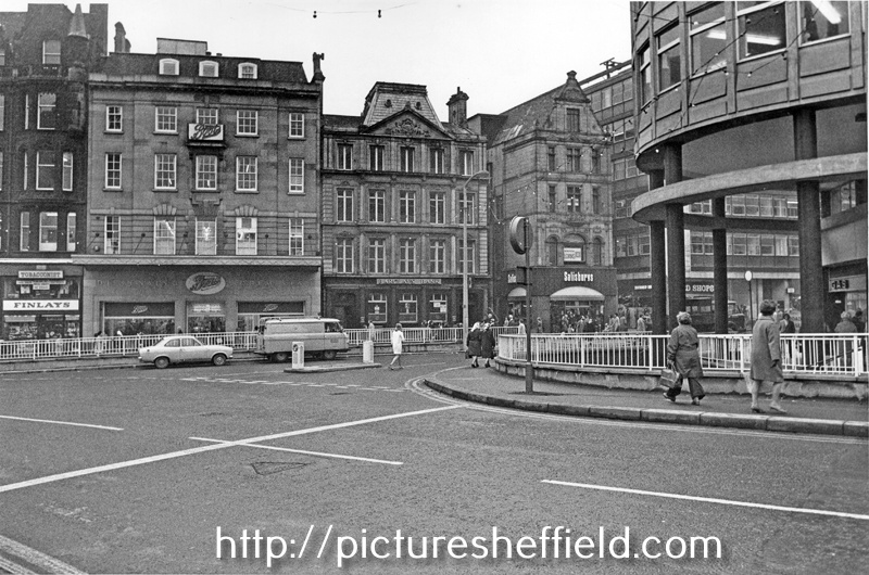 Coles Corner at the junction of High Street, Fargate and Church Street showing Finlay and Co. Ltd., tobacconists; Boots the Chemist; Barclays Bank (all High Street) and Salisburys Handbags Ltd., travel goods dealers (Fargate)