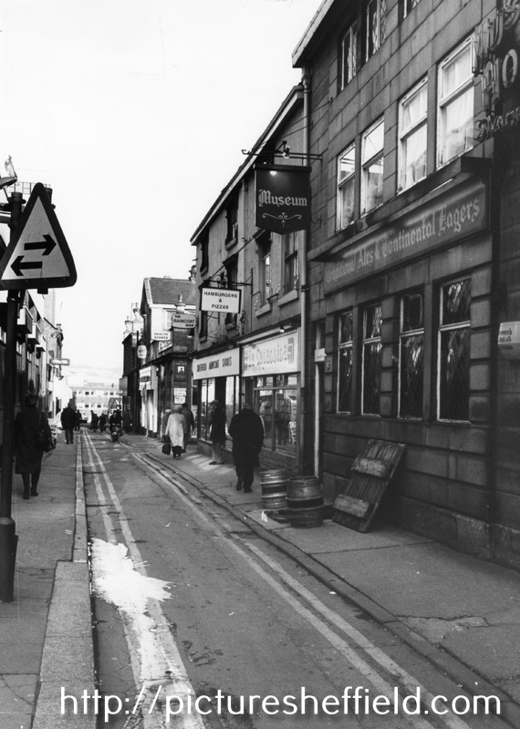 Nos. 25; Museum public house; 23, La Capannina Restaurant; 21, Sheffield Raincoat Stores, Orchard Street looking towards the junction with Orchard Place (right) and Church Street