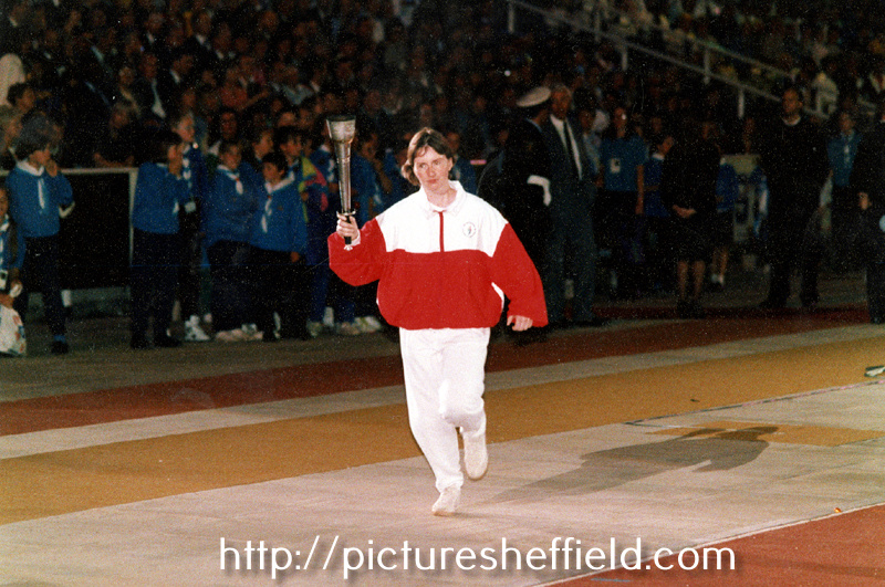 Helen Sharman with the World Student Games torch at the opening ceremony at Don Valley Stadium