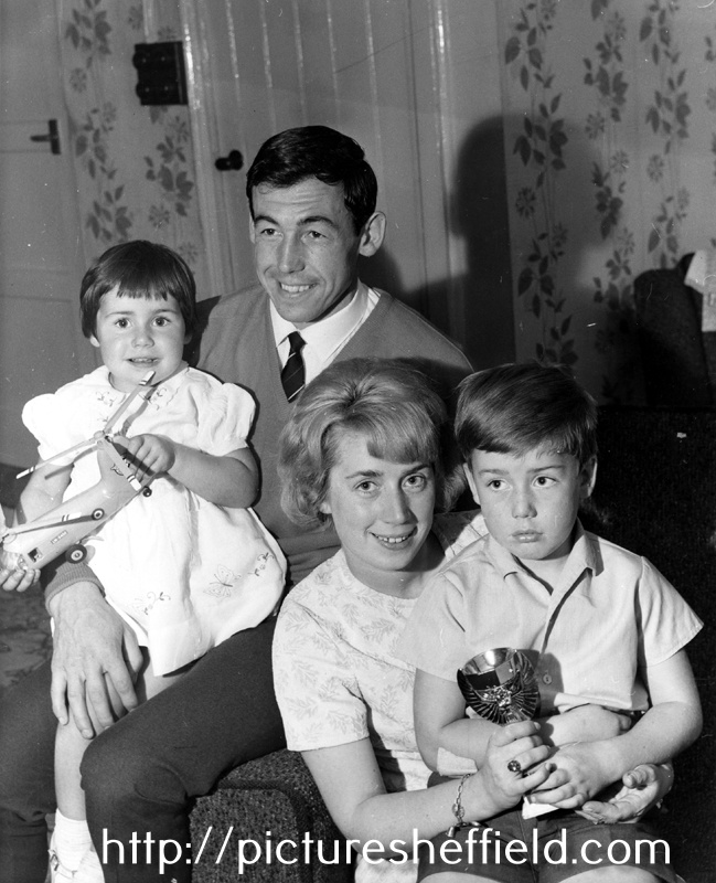 Tinsley born England World Cup winning goalkeeper Gordon Banks, wife Ursula, children Wendy aged 3 and Robert aged 8 with his Gold Replica of the World Cup, taken at Gordons' parents home at Hill Top Farm, Catcliffe