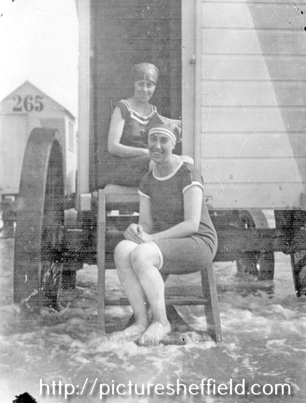 Ida Stringfellow (in doorway) and friend at Scarborough or Cleethorpes, with bathing machine