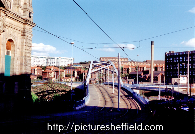Park Square Supertram Bridge, at bottom of Commercial Street, during the construction of Supertram. Hyde Park Flats, left, and Park Hill Flats, right, in background
