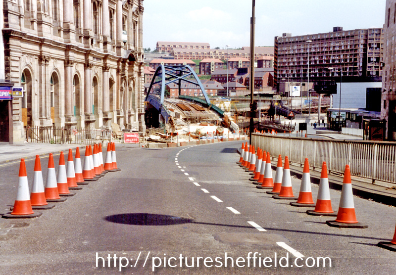 Commercial Street during the construction of Supertram, looking towards Park area. Old Gas Company Offices, known as Canada House, left. Park Hill Flats, right, in background