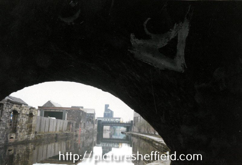 View of the derelict Parkers Wharf from underneath Cadman Street Bridge, Sheffield and South Yorkshire Navigation looking towards Midland Railway Bridge