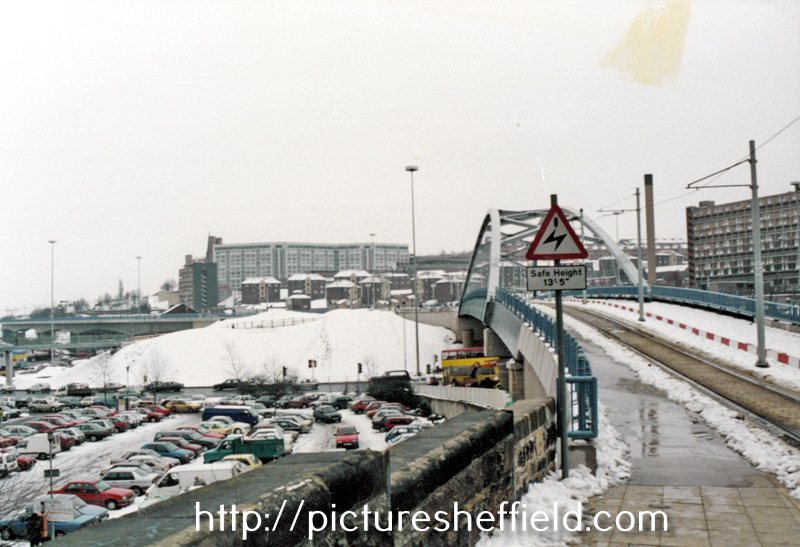 Snow on Bowstring Bridge with Hyde Park Flats in the background (left)