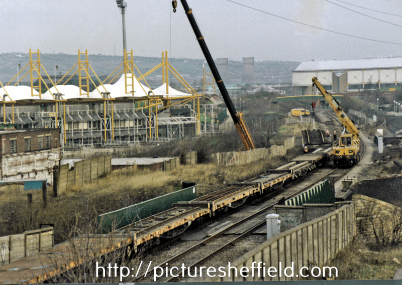 Laying Supertram tracks on the bridge over Worksop Road with Don Valley Stadium (left) and Sheffield Arena (right) in the background