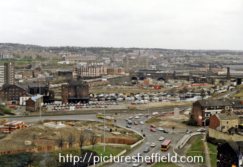 Elevated view of the construction of Supertram Viaduct, Park Square roundabout showing the Canal Basin before restoration